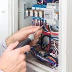 Electrician,at,work,on,an,electrical,panel